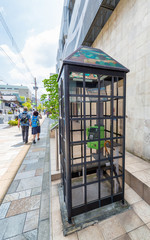 NARA, JAPAN - MAY 31, 2016: Public phone booth along city street. Nara is a famous tourist destination in Japan