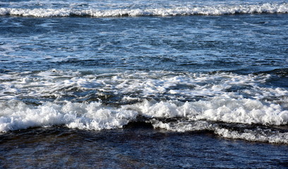 Waves rolling on the water, water nature. Summertime, blue sea and waves.