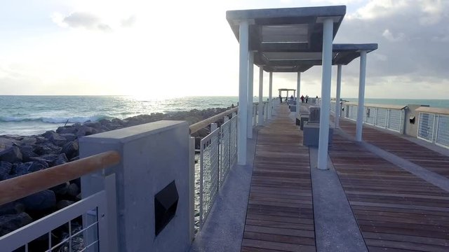 Miami Beach South Pointe Pier Stabilized Moving Shot Towards Sunny Sky