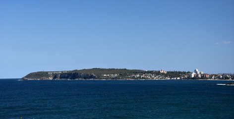 Fototapeta na wymiar Panoramic view of Manly and North Head from Long Reef Headland on a sunny day (Sydney, NSW, Australia).