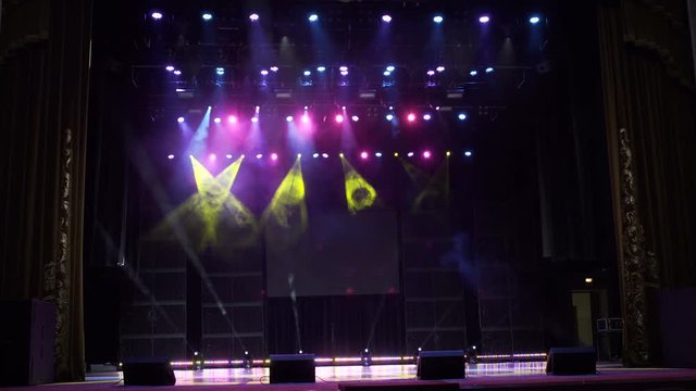 Multi-colored stage lights, light show at the concert. Light and smoke show on the stage. 4k