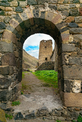 Fototapeta na wymiar View through arch. Khertvisi fortress on mountain. Georgia