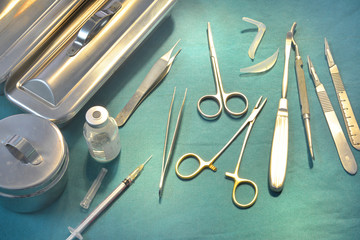 Surgical instruments, silicone nasal implant and silicone chin implants in operating room.