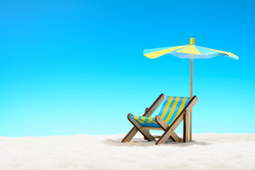 Sunbed at the beach on background of blue sky