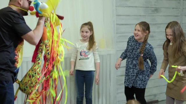 Clown animator entertains children on holiday shows tricks 4k