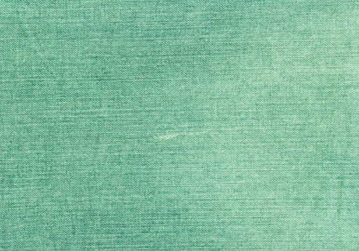 Green jeans textile texture.