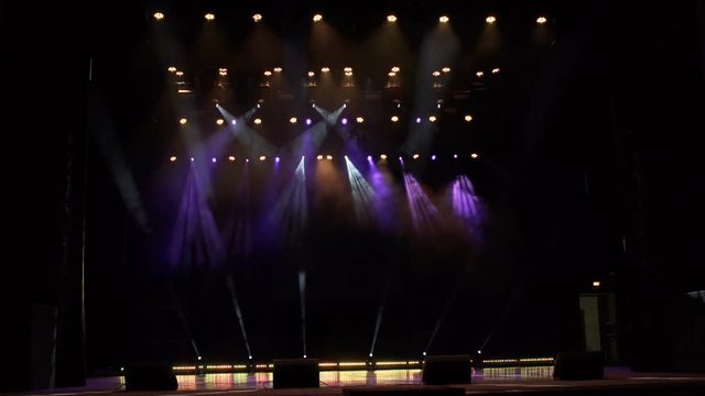 Flashing concert light in an empty theater. Free stage with lights. Stage lights. 4k