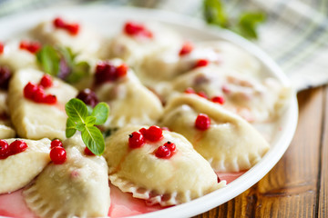 Sweet boiled dumplings with cherries and berries