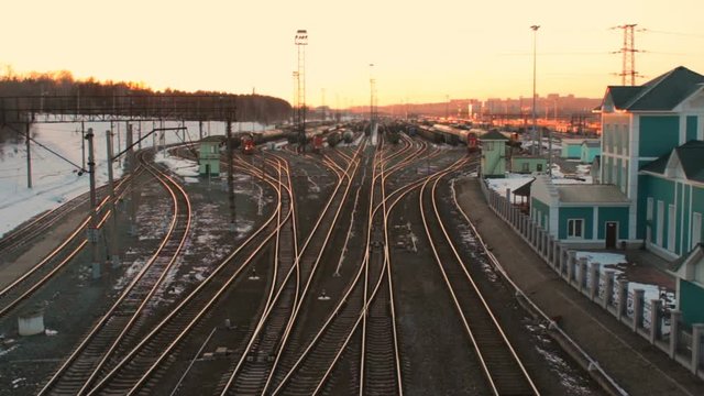 Railway station a lot of lines cargo trains rail freight marshalling yard sunset