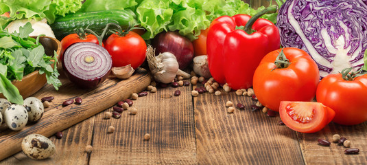 Food different vegetables on the wooden table with copy space