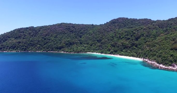 Panning aerial footage of Blue Lagoon beach Perhentian Island Malaysia