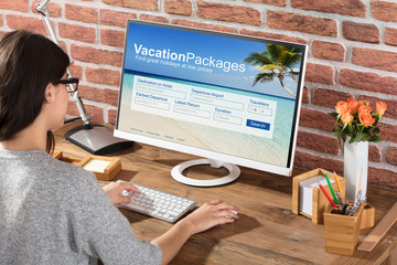 Woman Filling The Vacations Packages Form