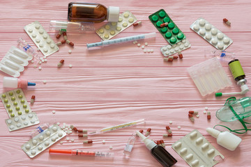 Blister packs. pills and drugs on a wooden table background. Pharmaceuticals backdrop.