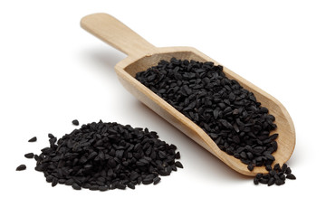 nigella seeds in wooden scoop