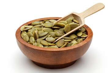 Pumpkin seeds in wooden bowl