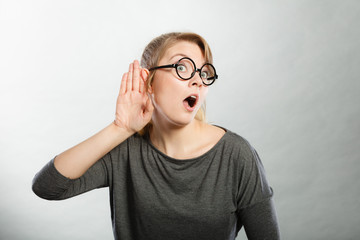 Shocked girl eavesdropping.