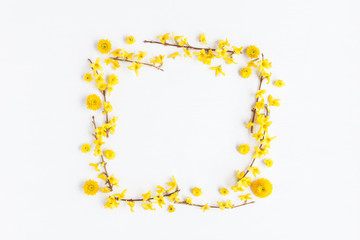 Flowers composition. Frame made of various yellow flowers on white background. Flat lay, top view