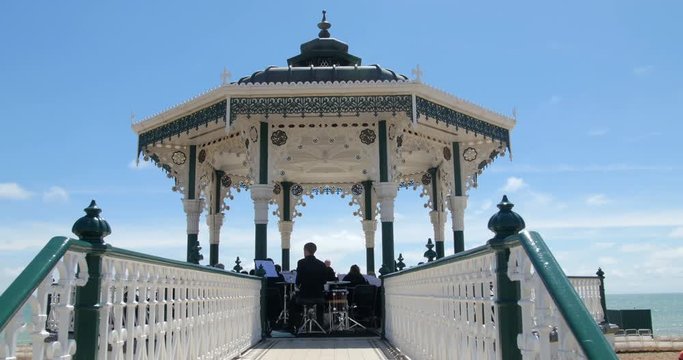 Orchestra playing music on the victorian bandstand in Brighton and Hove