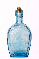 Old colourful bottles against a white background