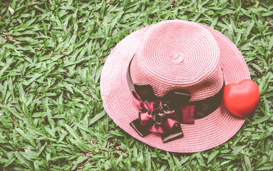 Heart on woman hat for use as love concept