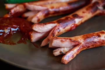 Fried sausages with ketchup