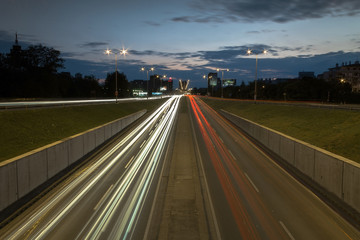 Car trail laights on a highway