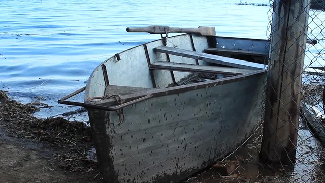 The metal boat on waves