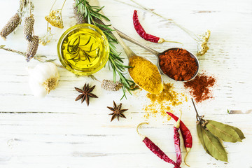 Spices and herbs on wooden background