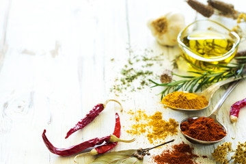 Spices and herbs on wooden background