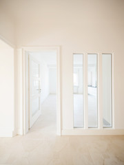 White corridor with doors