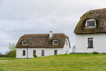 Fototapeta na wymiar countryside straw houses, Ireland
