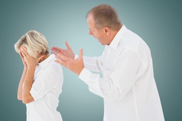 Side view of senior man arguing with woman