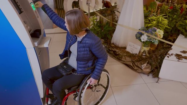 Physically challenged woman near ATM