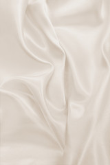 Smooth elegant golden silk or satin luxury cloth texture as wedding background. Luxurious background design. In Sepia toned. Retro style