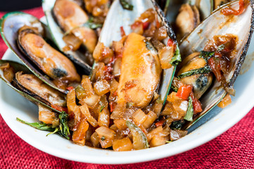 Mussel with white wine sauce on table