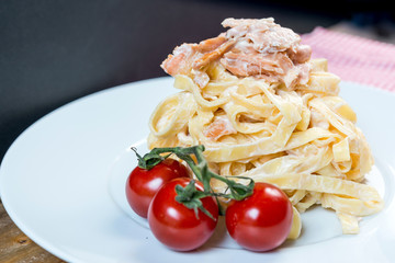 tasty pasta with salmon on a the table