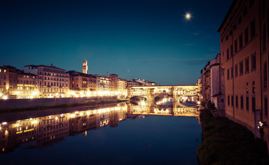 Fototapeta premium travel amazing Italy series - Ponte Vecchio and River Arno at Night, Florence, Tuscany