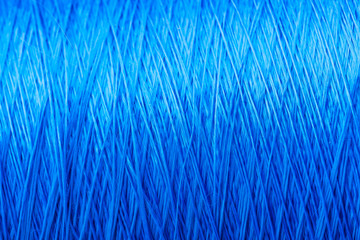 reel blue silk thread. textile concept. abstract background