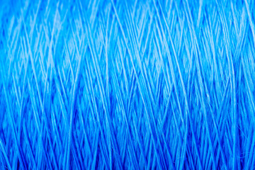 reel blue silk thread. textile concept. abstract background