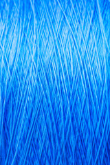 reel blue silk thread. textile concept. abstract background