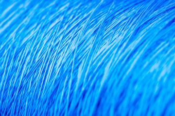 reel blue silk thread. textile concept. abstract background