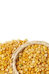 Dry yellow split peas isolated on white.