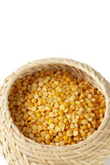 Dry yellow split peas isolated on white.