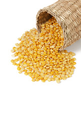 Dry yellow split peas isolated on white.