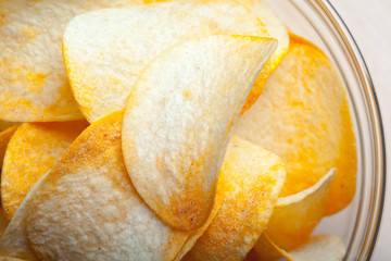 Potato chips in bowl on a table