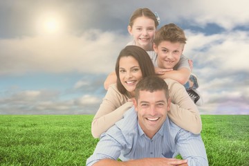 Fototapeta premium Happy family lying on each other at park