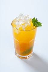 Summer lemonade with orange, ice and mint