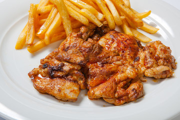 fried chicken with fries on white plate