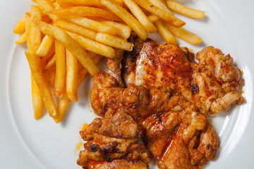 fried chicken with fries on white plate
