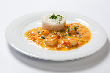 souse shrimp with greens and rice on a white background
